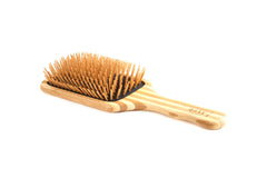 Bass The Green Brush bamboo pin large paddle angled view shows detangling-friendly bristles.