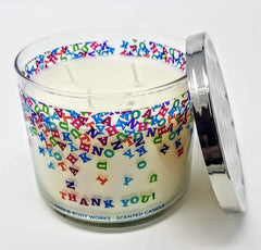 Closeup of Champagne Toast label on 3-Wick candle showing festive scent notes