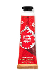 Bath & Body Works Winter Candy Apple travel-size hand cream nourishes hands with quick absorption and soft texture.