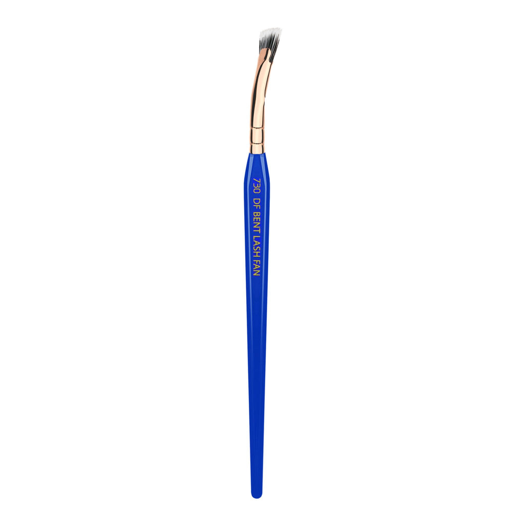 Bdellium Tools Golden Triangle 730 Bent Mascara Fan with blue handle for precise application.