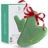 Beauty by Earth Jade Gua Sha face sculpting tool for jawline contour and facial tension relief.
