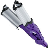 Bed Head Wave Artist Deep Waver with deep barrels for beachy waves and high shine.