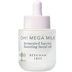 Beekman 1802 Oh! Mega Milky Oil bottle closeup showing a silky glow and barrier support.