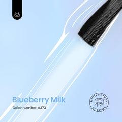 Beetles Blueberry Milk swatch highlights sheer blue finish for subtle nail art