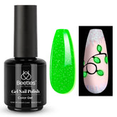 Beetles Christmas Gel Polish bottle glowing after light exposure for holiday flair.
