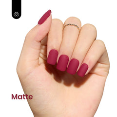 Beetles gel polish on nail under LED light demonstrates quick curing.