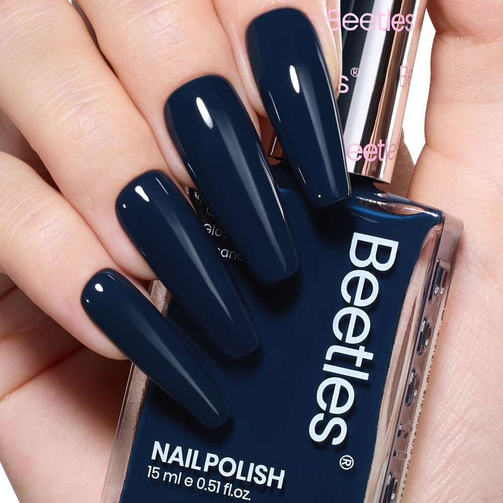 Beetles Navy Blue nail polish bottle close-up shows rich color for a bold winter manicure.