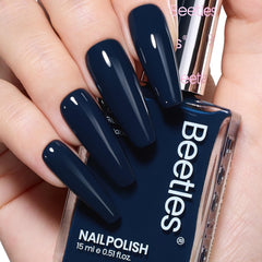 Beetles Navy Blue nail polish bottle close-up shows rich color for a bold winter manicure.