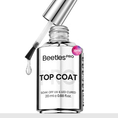 Beetles Pro Gel Top Coat bottle pour demonstrates smooth flow for precise application.