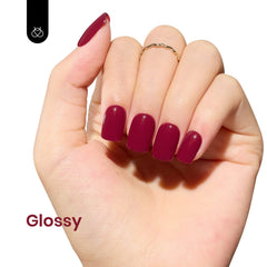 Beetles Red Gel Nail Polish on nail demonstrates glossy, long-lasting finish for DIY manicure.