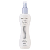 BioSilk Silk Therapy Thermal Shield spray bottle demonstrates heat protection for smooth styling.