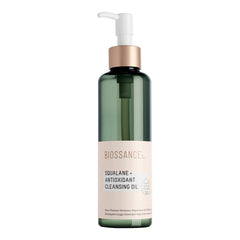 Biossance Squalane Cleansing Oil bottle pour shows gentle makeup removal and hydrating cleanse.