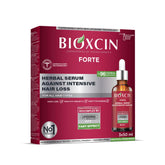 BIOXCIN anti-hair-loss serum bottle with pump delivers targeted scalp nourishment.