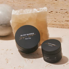 Blind Barber Bryce Harper Hair Clay jar closeup highlights kaolin as oil absorber for lift.