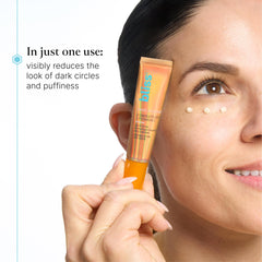 Bliss Rest Assured Eye Cream applied with ring finger for gentle under-eye care.