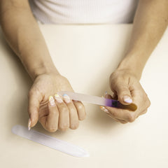 Bona Fide Beauty crystal glass nail file closeup showing gentle smoothing.