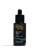 Bondi Sands Self Tan Drops dark bottle on counter for a customizable glow.