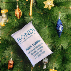 Bondi Spa hair towel stretched over hair shows super absorbent performance.