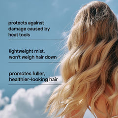 BONDIBOOST spray mist applying protection to damp hair for styling without damage.