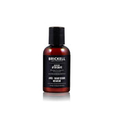 Brickell Men's Instant Relief aftershave balm bottle on bathroom counter for post-shave hydration.