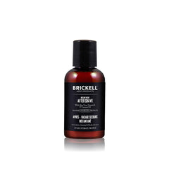 Brickell Men's Instant Relief aftershave balm bottle on bathroom counter for post-shave hydration.