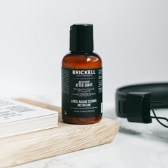 Brickell balm packaging on shelf highlighting natural ingredients.