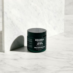 Brickell Smooth Brushless Shave Butter applied to skin to soften whiskers.