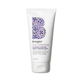 Briogeo Curl Charisma bottle closeup shows premium leave-in curl care for defined waves