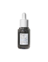 Briogeo Scalp Revival bottle pours, showcasing quick-absorbing hydration.