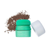 Briogeo Style & Treat Dry Shampoo Puff on dark hair roots for instant refresh.