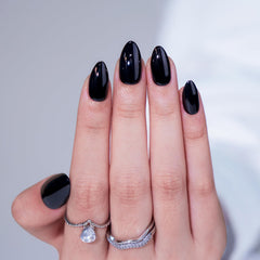 BTArtbox Black Press On Nails Almond kit laid out with 16 sizes for a custom fit.