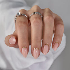 BTArtbox press-on almond nails with gold foil on nude base for subtle everyday shimmer.