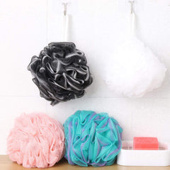 BTYMS bath sponge being rinsed and dried for quick reuse.
