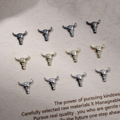 Bull Head Charms gun-black head closeup offers edgy Halloween vibe