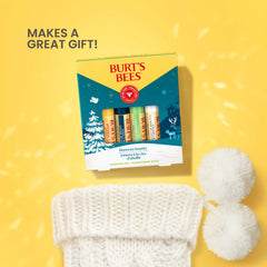 Burt's Bees Coconut and Pear lip balm tube close-up, tropical notes for daily lip care.