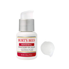 Compact packaging of Burt's Bees Renewal Eye Cream on a bathroom counter.