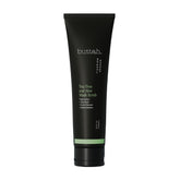 Buttah Tea Tree Aloe Scrub bottle demonstrates premium packaging for a purifying cleanse.