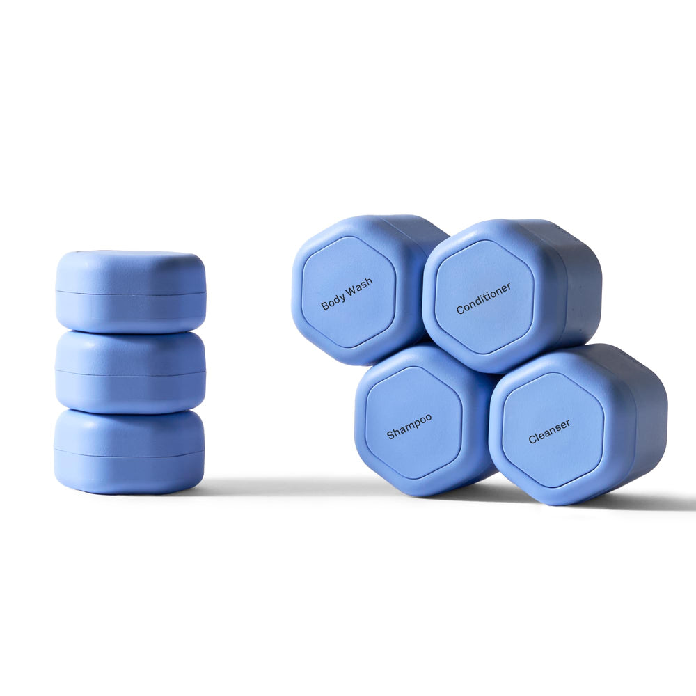 Cadence travel containers with magnetic tiles show modular organization for toiletries.
