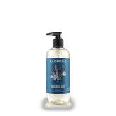 Caldrea Basil Blue Sage bottle-pump shows clean hands with soothing aroma.