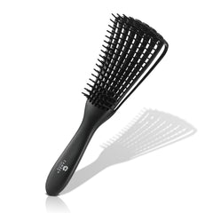 CamDen Premium Detangler Brush on wet hair for effortless detangling and smooth styling.