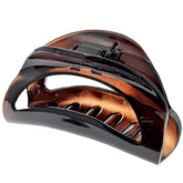 Camila Paris CP1562 thick-hair-clip closeup shows secure hold for voluminous hair.