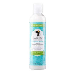 Camille Rose Coconut Water Leave-In bottle closeup for detangling hydration.