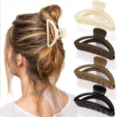 Canitor neutral off-white claw clip secures a sleek bun for everyday wear