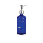 Capri Blue Volcano hand wash bottle on sink, adding style and light fruity scent.