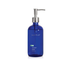 Capri Blue Volcano hand wash bottle on sink, adding style and light fruity scent.