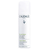 Caudalie Grape Water Mist travel-size bottle for on-the-go hydration.