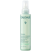 Caudalie Vinoclean cleansing oil bottle with pour for quick, effective makeup removal.