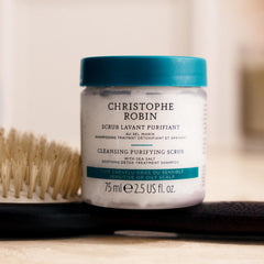 Christophe Robin scrub massaged onto scalp suggests soothing, purifying routine.