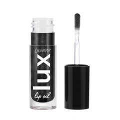 ColourPop Twilight Lux Lip Oil bottle closeup shows glossy, hydrating formula for nourished lips.
