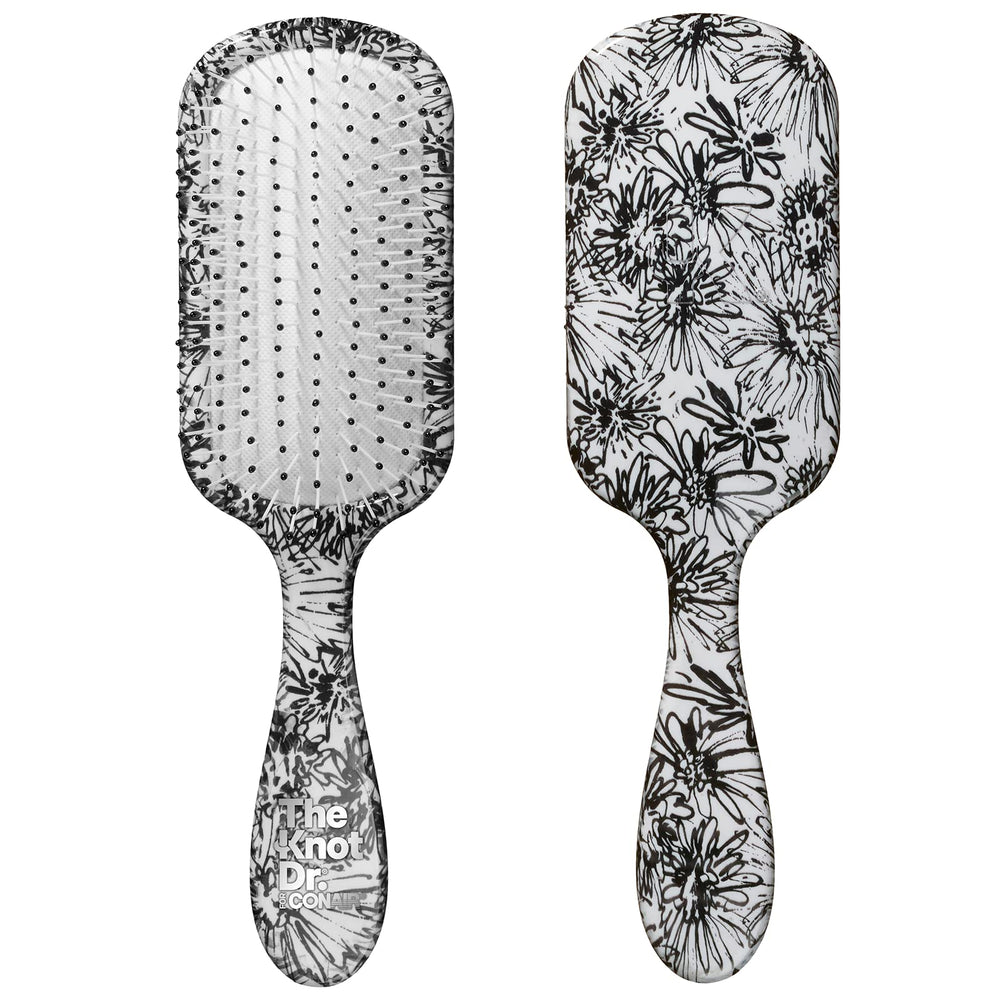 Conair Knot Dr detangler brush with a daisy print for smooth detangling on wet or dry hair